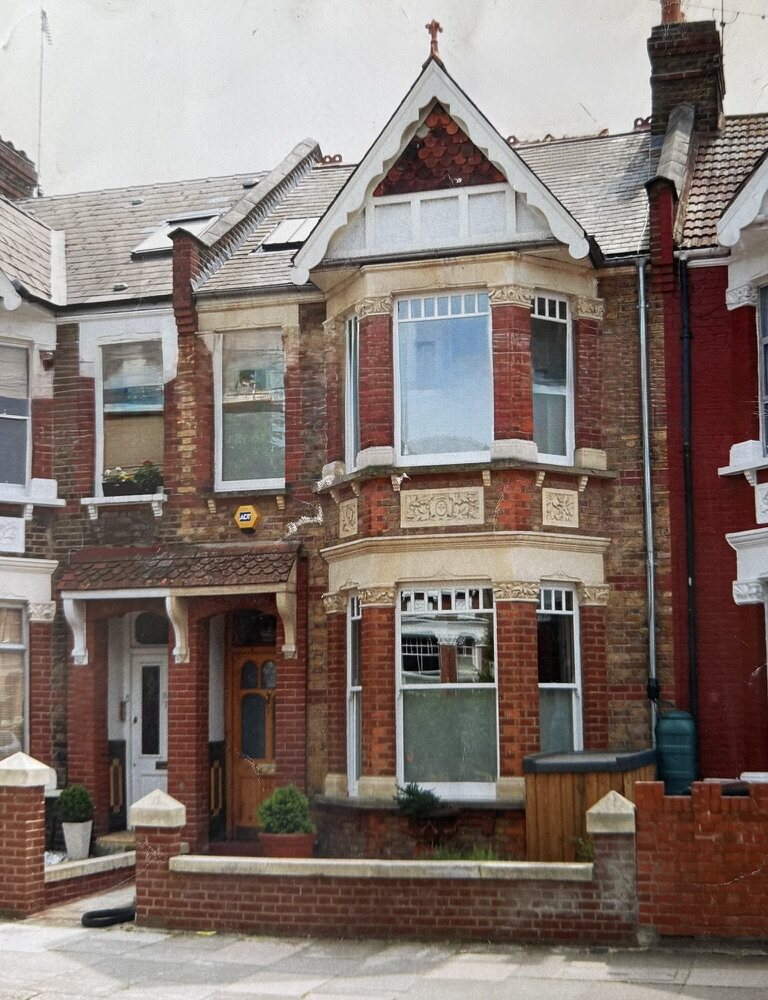 69 Keslake Road today: the Victorian terrace house from the street after its fabric-first retrofit, with recarved stonework and timber sash windows